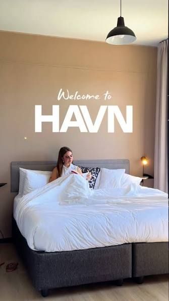 A guest in a HAVN aparthotel room