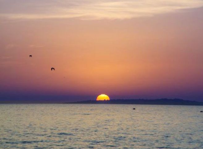 Sunset over the Atlantic Ocean, the inspiration for Latitude